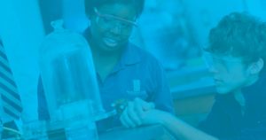 Blue image with student wearing science glasses doing an experiment